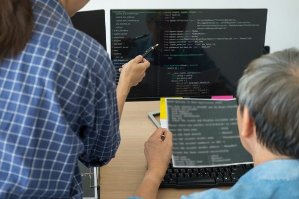 IT office Programmers software development coding technologies On Computer working in a company IT office Programmers software development coding technologies On Computer working in a company